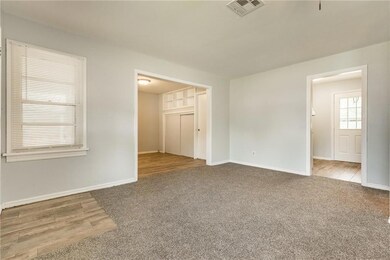 Empty room with baseboards and carpet floors