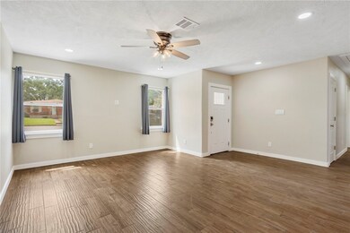 Open concept living room with healthy amount of na