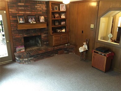 1 of 2 living with the Brick fireplace w/builtin/ game room/office/work out room