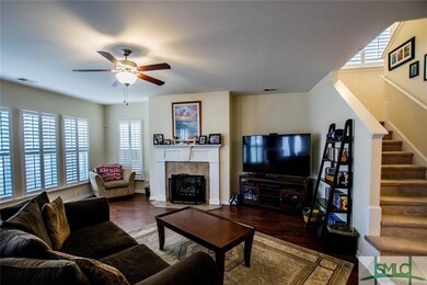 Living Room featuring Fireplace with Gas Logs Plan