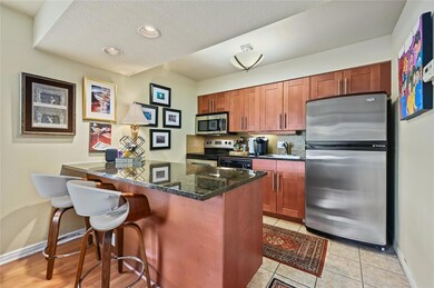Kitchen featuring a sink, a kitchen breakfast bar