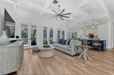 Living area featuring light wood-style flooring, v