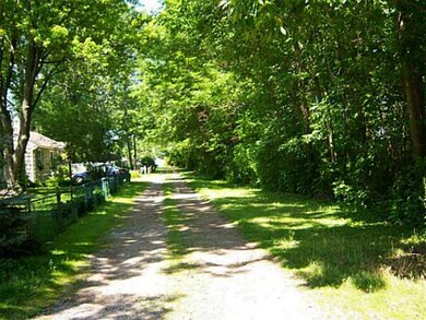 View. Looking down the private drive to the lake...just a short, short walk.