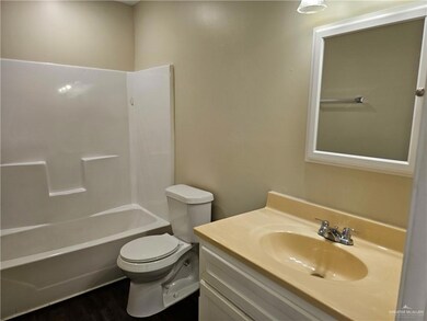 Full bathroom featuring wood-type flooring, vanity, toilet, and bathing tub / shower combination