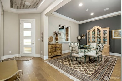 Entry way with flex room, being used as formal dining area