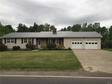 Front of house showing 2 stall garage