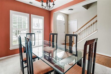 Front entryway boast a beautiful entry hall with access to garage, upstairs, and front dining/office.