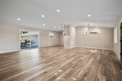 In the great room looking to the dining room and kitchen - cabinets & counters to be installed. 