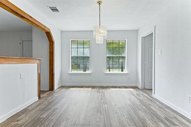 Unfurnished dining area featuring wood-type floori