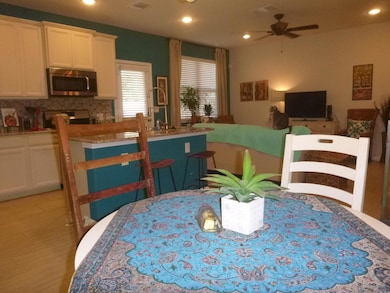 Dining room with recessed lighting and ceiling fan