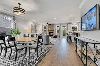 Stock Model Photo. Open Dining Room and Great Room with Optional Stone Fireplace!