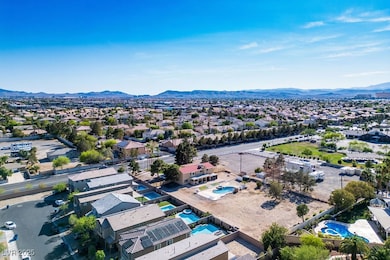 Birds eye view of property with a residential view and a mountain view