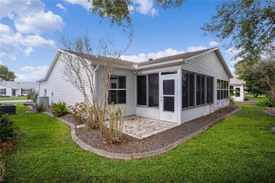 Rear of home with enclosed lanai and porch for gri