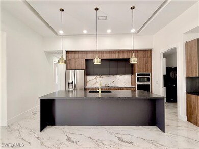 Kitchen with appliances with stainless steel finis