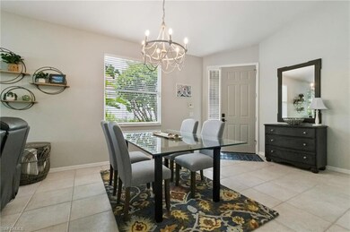 Dining area with a chandelier and light tile patterned floors