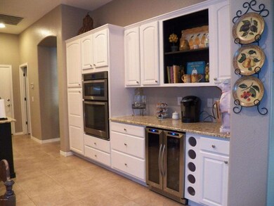 Wall Ovens + Wine Fridge.