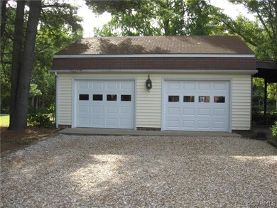2.5 Car Garage (28x24) Brick & Vinyl, Newer Doors and Openers.
