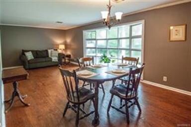 Gorgeous floor to ceiling windows fill this extra 