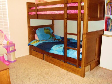 Bedroom Two views greenbelt and has a double door