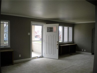 Large living room and entrance to home.
