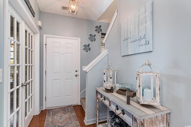 Entrance foyer with dark wood-type flooring