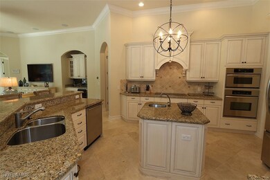 Kitchen with arched walkways, stainless steel dish