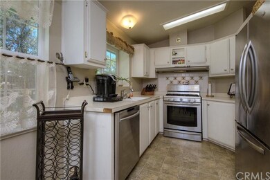Kitchen with stainless steel appliances & white ca