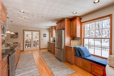 Gourmet kitchen with solid maple cabinets and gran