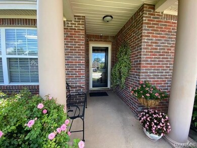 Lovely front entry way with covered porch and glas