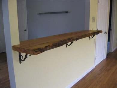 Beautiful finished wood breakfast bar.