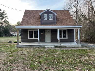 View of front of home featuring covered porch and
