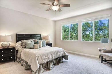 Large master bedroom with wall of windows allowing