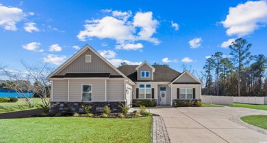 Craftsman-style home with a front yard