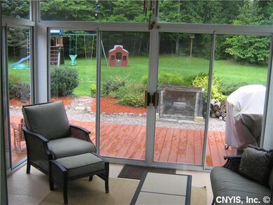 Exterior Back Enjoy this Enclosed 3 Season Rm