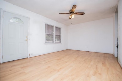 Entryway with light wood-style floors and ceiling fan