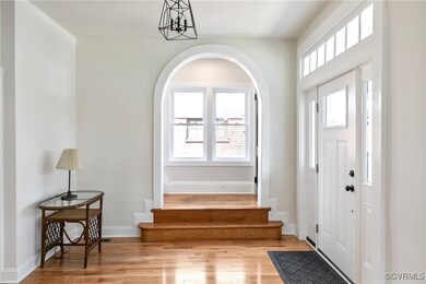 Entryway featuring light wood-style floors, stairw