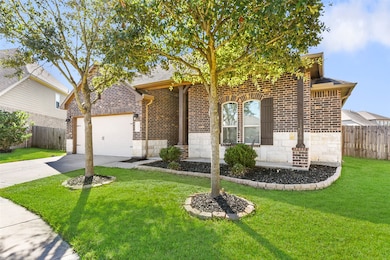 This stunning home showcases fantastic curb appeal with a well-manicured lawn, beautiful landscaping, and a charming brick and stone elevation. It also features a spacious covered front porch, perfect for enjoying front yard activities.