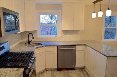 The kitchen has been completely remodeled w/ new m