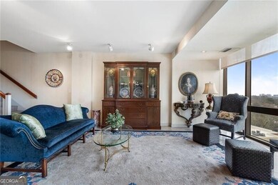 Living area with visible vents and stairs