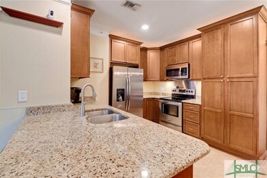 Kitchen with granite counters and stainless applia