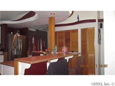 Kitchen. Stainless refrigerator and full wall pant