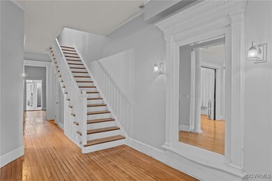 Stairway with hardwood / wood-style floors