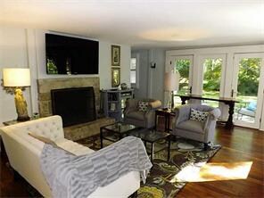 Living Room. Granite raised hearth fireplace origi