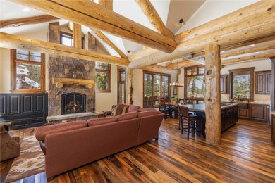 Entertain in the spacious living area that is open to the kitchen and dining areas.  The logs are beatle kill spruce trees from Utah.