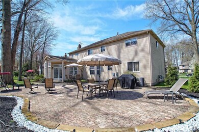 New Paver Patio and manicured landscaping in backy