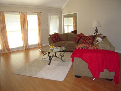 One view of great room, looking toward windows.