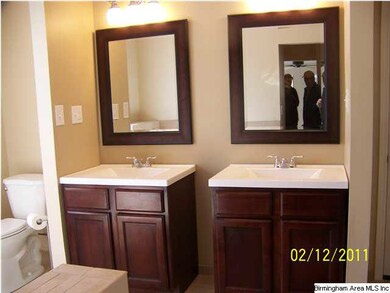 Master bath has double vanities, new ceramic tile,