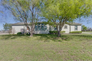 Single story home featuring a front lawn