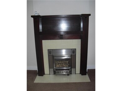 Living Room. The decorative fireplace in the livin