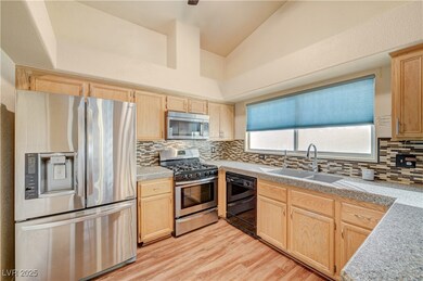 Kitchen featuring stainless steel appliances, ligh